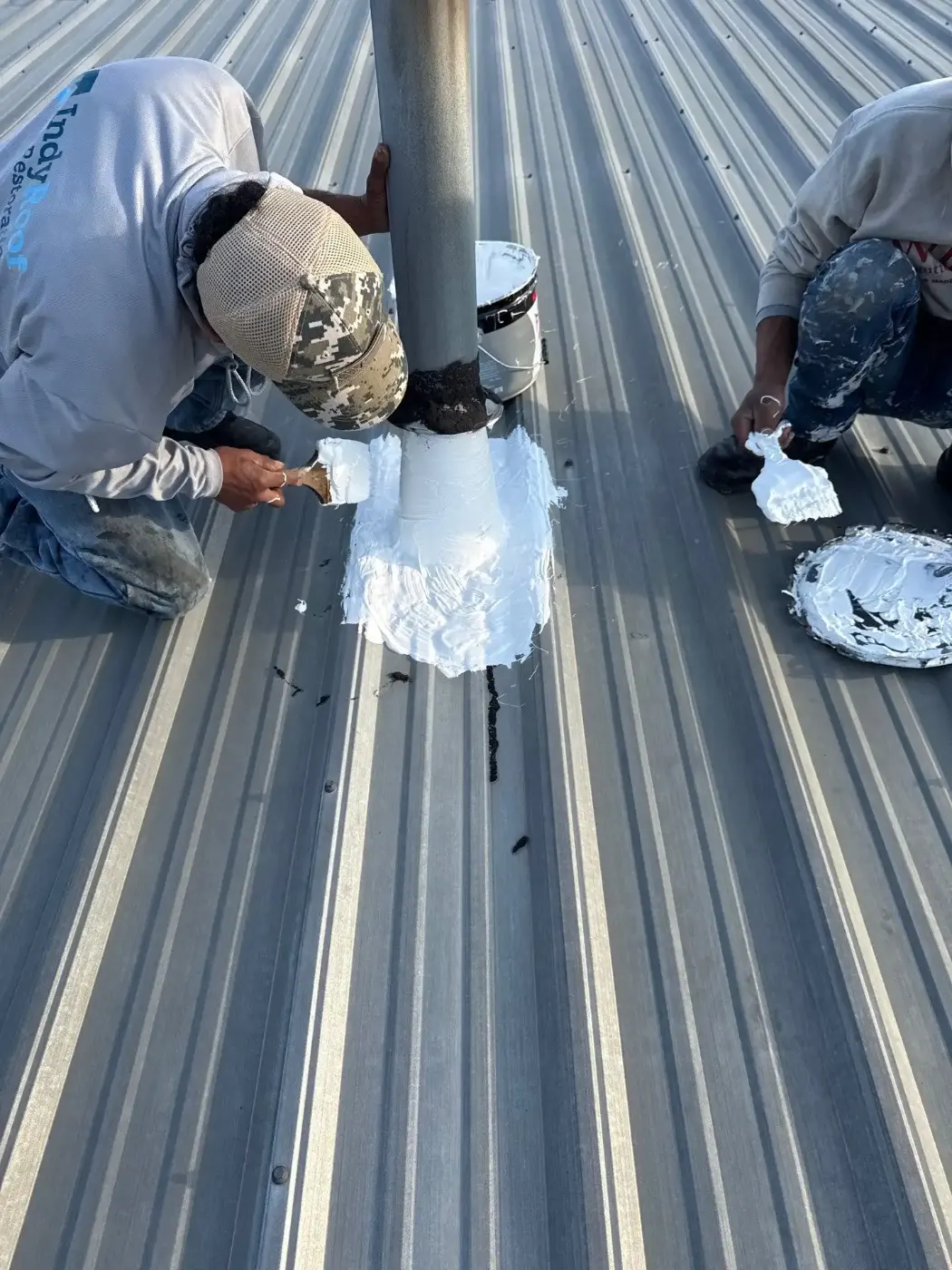 Tarping and dry-in on a Chatham Hills commercial roof